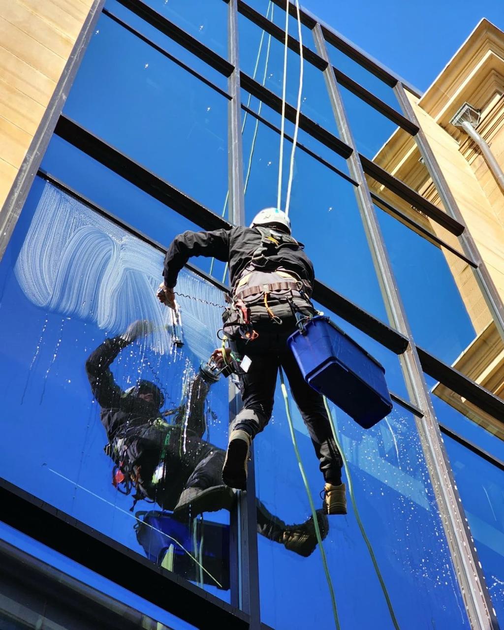 BrightSide technician cleaning high-rise glass